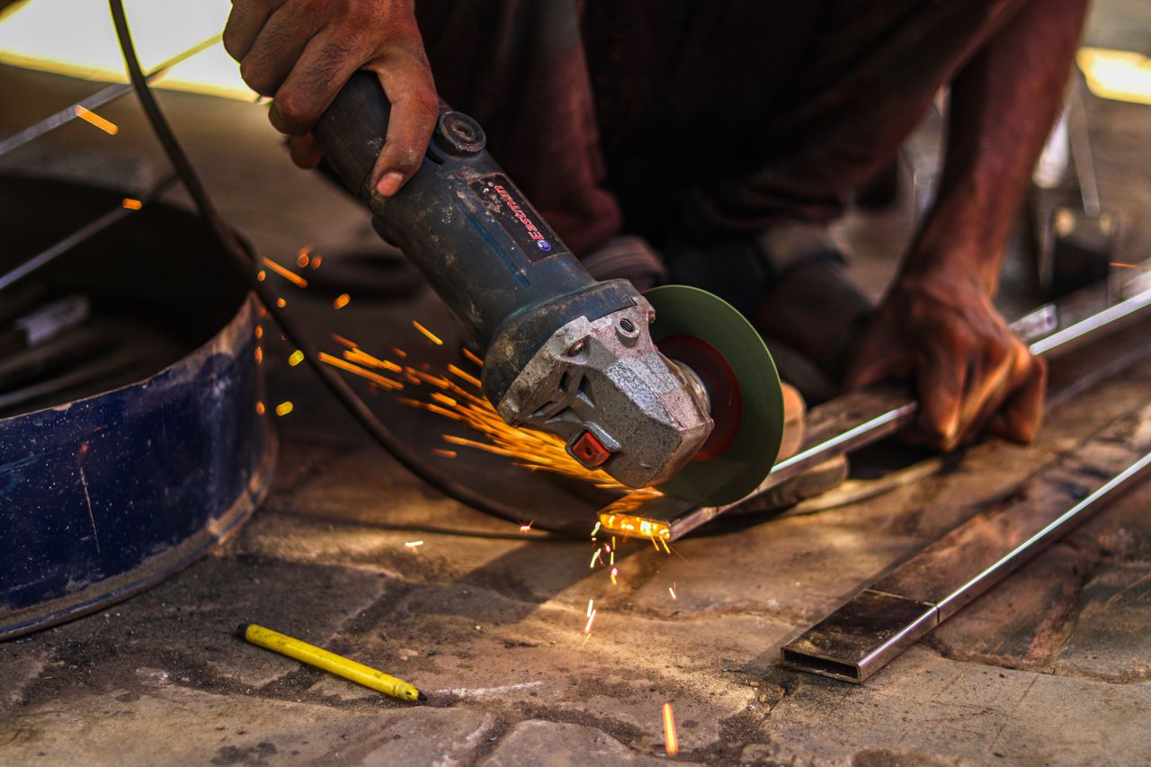 Grinding a weld flush with an angle grinder