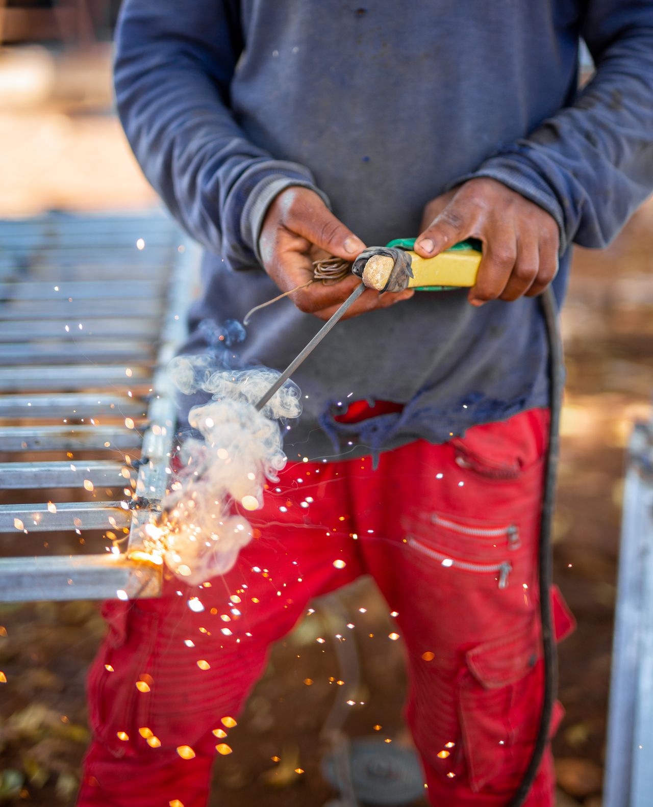 Laying down a weld bead with sparks flying